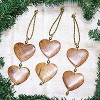Wood ornaments, 'Cheerful Hearts' (set of 3) - Fair Trade Hand-carved Wood Ornaments (set of 3)