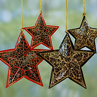 Wood Christmas ornaments, 'Midnight Blossoms' (set of 4) - Hand Painted Black Wood Star Christmas Ornaments (Set of 4)