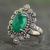 Onyx cocktail ring, 'Green Daisy Halo' - Sterling Silver Cocktail Ring with Faceted Green Onyx thumbail