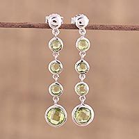Rhodium plated peridot dangle earrings,