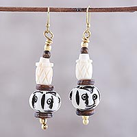 Bone beaded dangle earrings, 'Enigmatic Expressions' - Hand-Carved Natural Bone Dangle Earrings from India