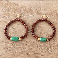 Wood and resin beaded stretch bracelets, 'Friendship Harmony' (pair) - Wood and Green Resin Beaded Stretch Bracelets (Pair)
