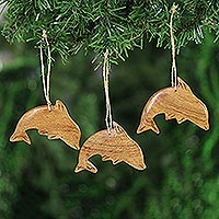 Wood ornaments, 'Happy Dolphins' (set of 3) - Dolphin-Themed Wood Ornaments from India (Set of 3)