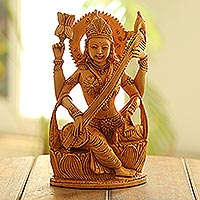 Wood sculpture, 'Saraswati Plays' - Hand Crafted Kadam Wood Saraswati Sculpture