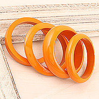 Mango wood bangle bracelets, 'Orange Fusion' (set of 4) - Set of 4 Mango Wood Orange Bangle Bracelets from India
