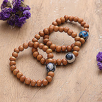 Wood and ceramic beaded stretch pendant bracelets, 'United Orbs' (set of 3) - 3 Painted Wood & Ceramic Beaded Stretch Pendant Bracelets
