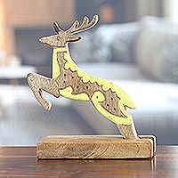 Wood sculpture, 'Reindeer Dream' - Hand-Carved Mango Wood Reindeer Sculpture with Yellow Tones