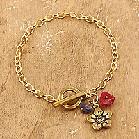 Agate charm bracelet, 'Harmony Bloom' - Floral Brass Charm Bracelet with Agate Chips from India