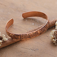 Copper cuff bracelet, 'Timeless Lotus' - Lotus Flower Fish Geometric-Themed Copper Cuff Bracelet