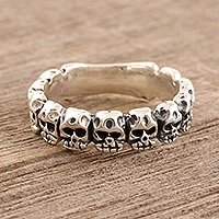 Sterling silver band ring, 'Row of Skulls' - Sterling Silver Skull Band Ring from India