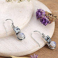 Blue topaz and rainbow moonstone dangle earrings, 'Sky Glimmer' - Blue Topaz and Rainbow Moonstone Dangle Earrings from India