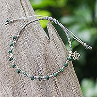 Silver braided beaded bracelet, 'Bohemian Glances' - Handcrafted Braided Bracelet with Silver Hill Tribe Charm