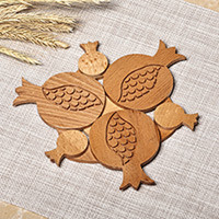 Wood trivet, 'Pomegranate Sensations' - Pomegranate-Shaped Hand-Carved Beechwood Trivet