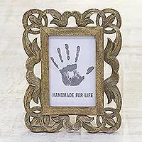 Wood photo frame, 'Beauty on the Vine' (4x6) - Hand Carved Openwork Leaf Motif Mango Wood Photo Frame (4x6)