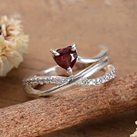 Garnet and cubic zirconia cocktail ring, 'Valentine Promise' - Crisscross Garnet Pave Cubic Zirconia Silver Cocktail Ring