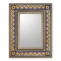 Tin and ceramic wall mirror,