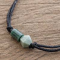 Jade pendant necklace, 'Gradient Stone' - Two-Color Green Jade Pendant on Black Cotton Cord Necklace