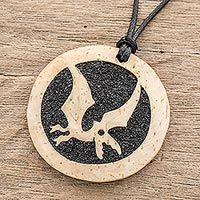 Coconut shell and lava stone pendant necklace, 'Microraptor' - Coconut Shell and Lava Stone Microraptor Pendant Necklace
