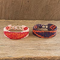 Beaded wristband friendship bracelets, 'Banner in Orange' (pair) - Handmade Beaded Friendship Bracelets from Guatemala (Pair)