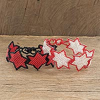 Beaded wristband friendship bracelets, 'Star Duo in Red' (pair) - Star-Themed Red Beaded Friendship Bracelets (Pair)