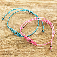 Beaded macrame bracelets, 'Art of Knots in Blue and Pink' (pair) - Handcrafted Pastel Macrame Cord Bracelets (Pair)