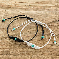 Beaded macrame bracelets, 'Art of Knots in Onyx and White' (pair) - Handcrafted Beaded Macrame Cord Bracelets (Pair)