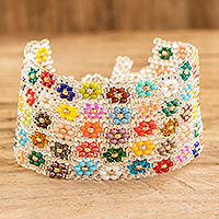 Glass beaded wristband bracelet, 'Ethereal Blossoming Harmony' - Handcrafted Floral Glass Beaded Wristband Bracelet