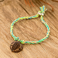 Coconut shell braided pendant bracelet, 'Tropical Turtle' - Cotton Braided Bracelet with Coconut Shell Turtle Pendant