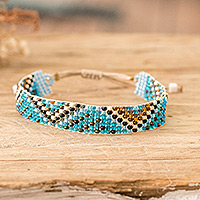 Beaded wristband bracelet, 'Magical Atitlan' - Handmade Sky Blue and Golden Glass Beaded Wristband Bracelet