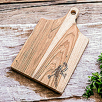 Wood cutting board, 'Macaw's Delicacies' - Handcrafted Laurel Wood Cutting Board with Macaw Engraving
