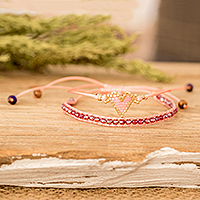 Glass beaded friendship bracelets, 'Adorable Bond' (set of 2) - Set of 2 Handcrafted Pink Heart-Themed Friendship Bracelets