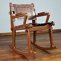 Mohena wood and leather rocking chair,