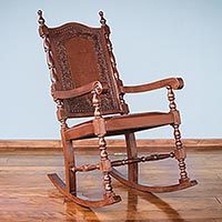 Mohena wood and leather rocking chair,