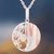 Sterling silver pendant necklace, 'Mokume Circle' - Sterling Silver and Copper Pendant Necklace from Peru thumbail