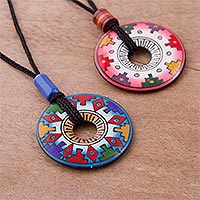 Ceramic pendant necklaces, 'You and I' (pair) - Hand Painted Pink and Blue Ceramic Pendant Necklaces (pair)