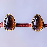 Gold accented obsidian button earrings,