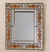 Reverse-painted glass wall mirror, 'Reflective Bouquet' - Orange Floral Reverse-Painted Glass Wall Mirror from Peru thumbail