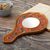 Reverse-painted glass hand mirror, 'Honeysuckle Garden' - Hand Painted Glass and Wood Hand Mirror thumbail