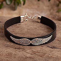 Leather and sterling silver pendant bracelet, 'Flight Path' - Black Leather and Silver Bracelet with Wing Pendant