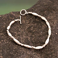 Sterling silver beaded wristband bracelet, 'Moon Harvest' - Handmade Sterling Silver Toggle Bracelet with Oval Beads