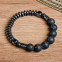 Hematite and vulcanite beaded stretch bracelet, 'Night Worlds' - Black Hematite and Vulcanite Beaded Stretch Bracelet