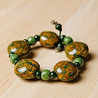 Ceramic beaded stretch bracelet, 'Nature's Victory' - Hand-Painted Yellow and Green Ceramic Beaded Bracelet