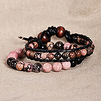 Leather and rhodonite beaded bracelets, 'Compassionate Energies' (set of 2) - Black Leather and Natural Rhodonite Bracelets (Set of 2)