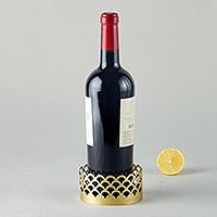Gold-plated brass bottle coaster, 'Elegant Entertainer' - Modern Brass Champagne Wine Bottle Coaster from India