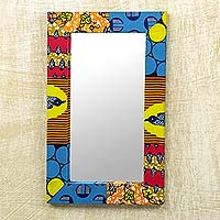 Wood and cotton wall mirror, 'Asasaawa' - Wall Mirror with Brightly Printed Fabric Frame from Ghana