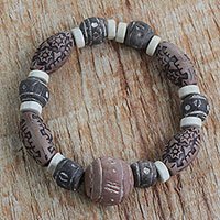 Terracotta, recycled plastic and glass beaded stretch bracelet,