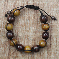 Wood beaded bracelet, 'Lively Shades' - Adjustable Sese Wood Beaded Bracelet from Ghana