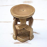 Wood decorative stool, 'Fantastic Forms' - Artisan Crafted Cedar Wood Decorative Stool from Ghana