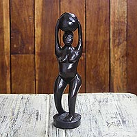 Wood sculpture, 'Nea Oko Nsu' - Black Sese Wood Sculpture of a Woman with a Pot from Ghana