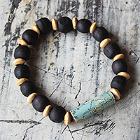 Wooden bead stretch bracelet, 'Circle the Globe' - Unisex Sese Wood Bracelet with Recycled World Map Bead